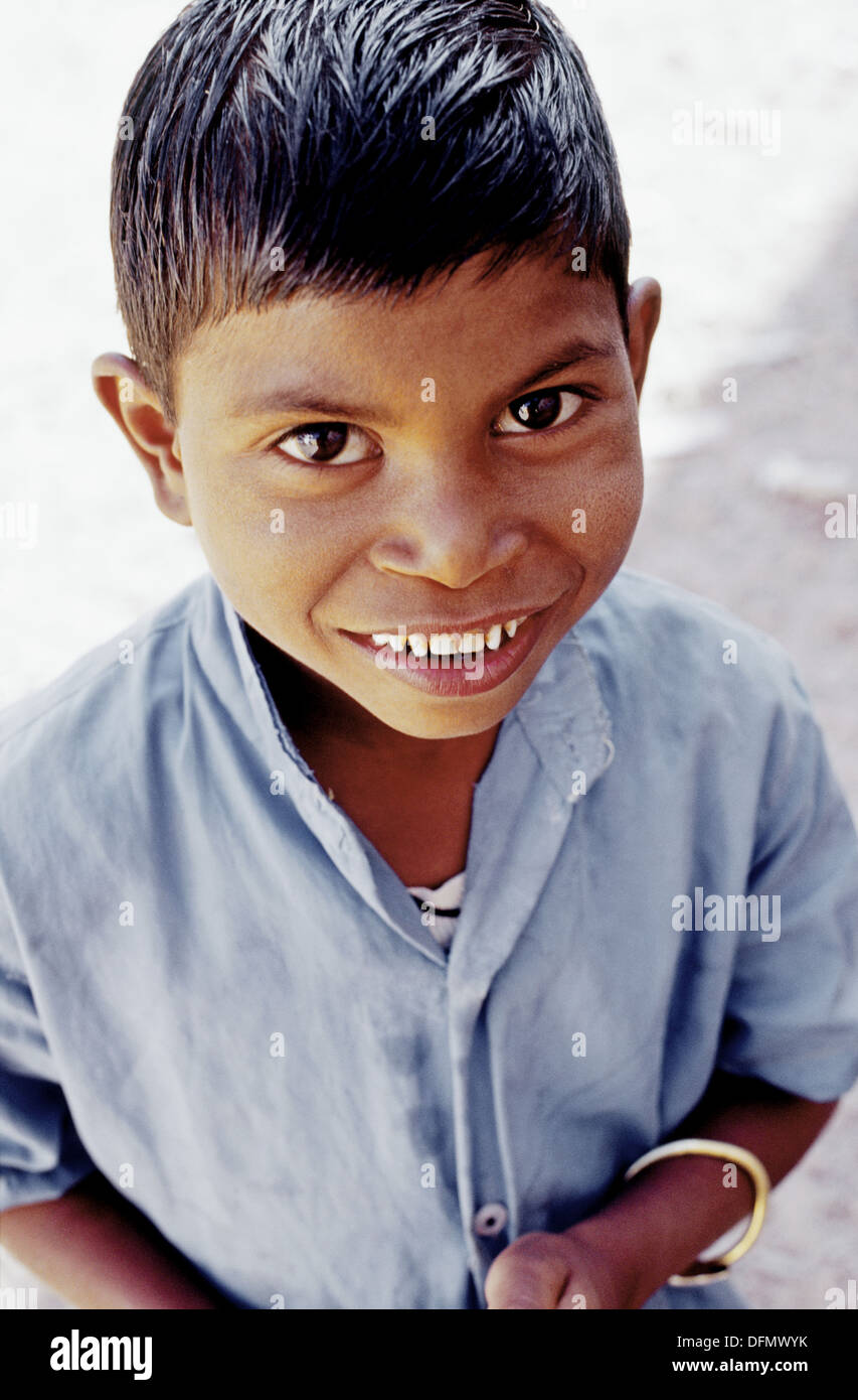 Embryo tolerantie Fjord Young Indian boy with a big smile and wet hair wearing a blue shirt looking  up Stock Photo - Alamy