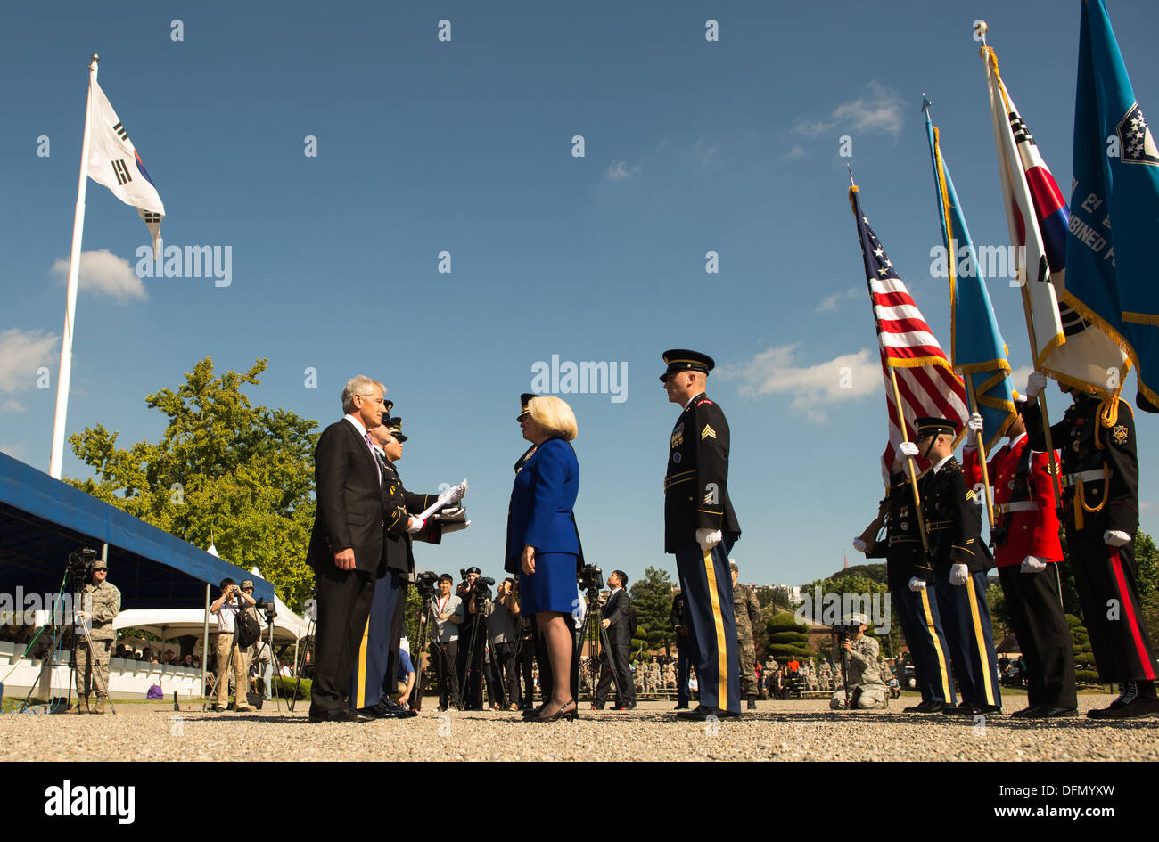 Defense Secretary Chuck Hagel presents Gen. James D. Thurman and his wife with an award during a change-of-command ceremony for Stock Photo