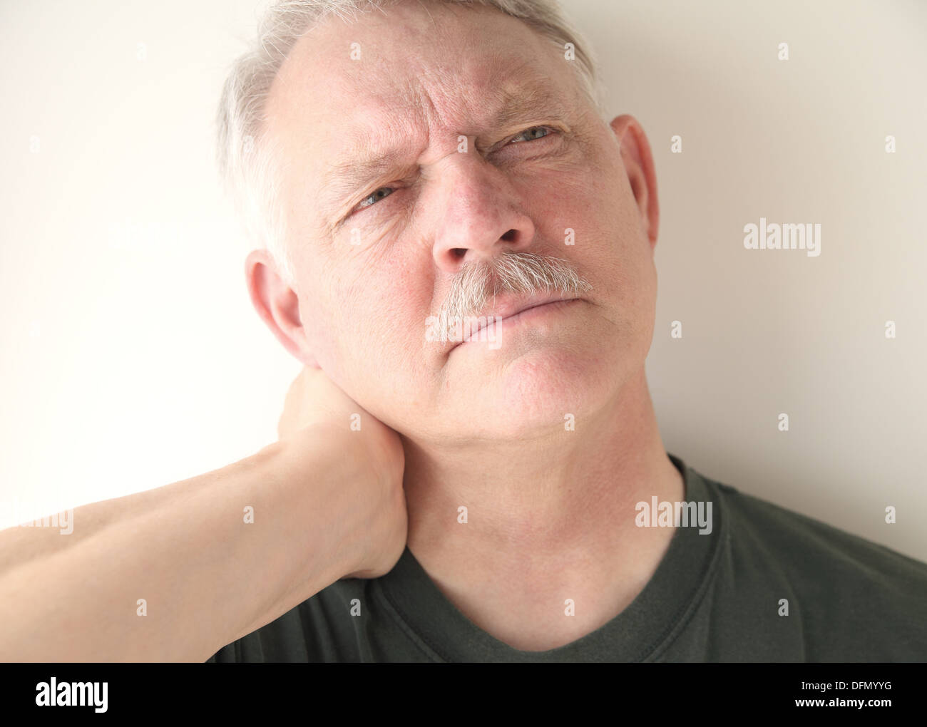 mature man with soreness in his neck Stock Photo
