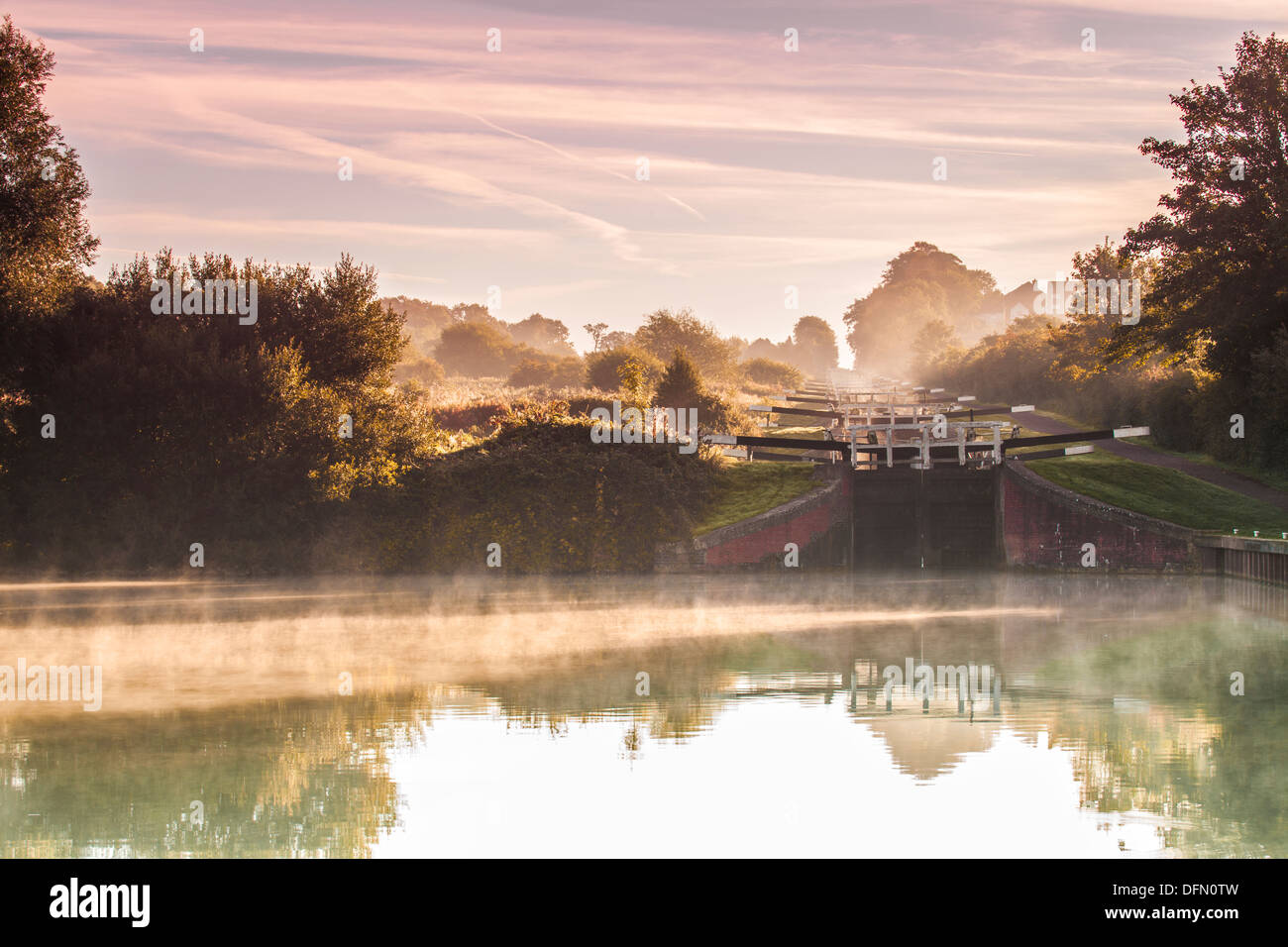 Early morning mist at Caen Hill Locks on the Kennet and Avon Canal in Devizes, Wiltshire. Stock Photo