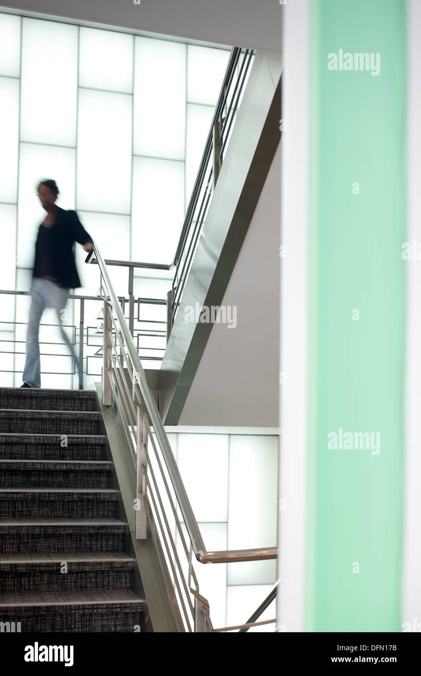 Man on the stairs in a hotel, Brussels, Belgium Stock Photo