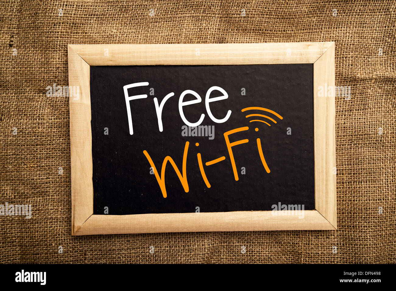 Free WiFi message on black notice board. Stock Photo