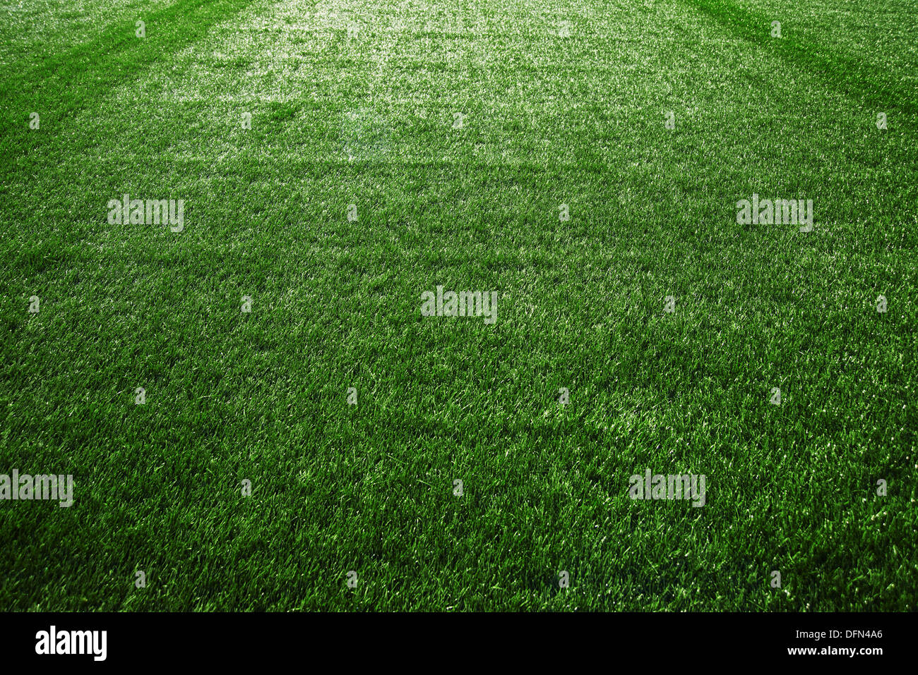 Artificial turf at soccer field, green plastic grass as background ...