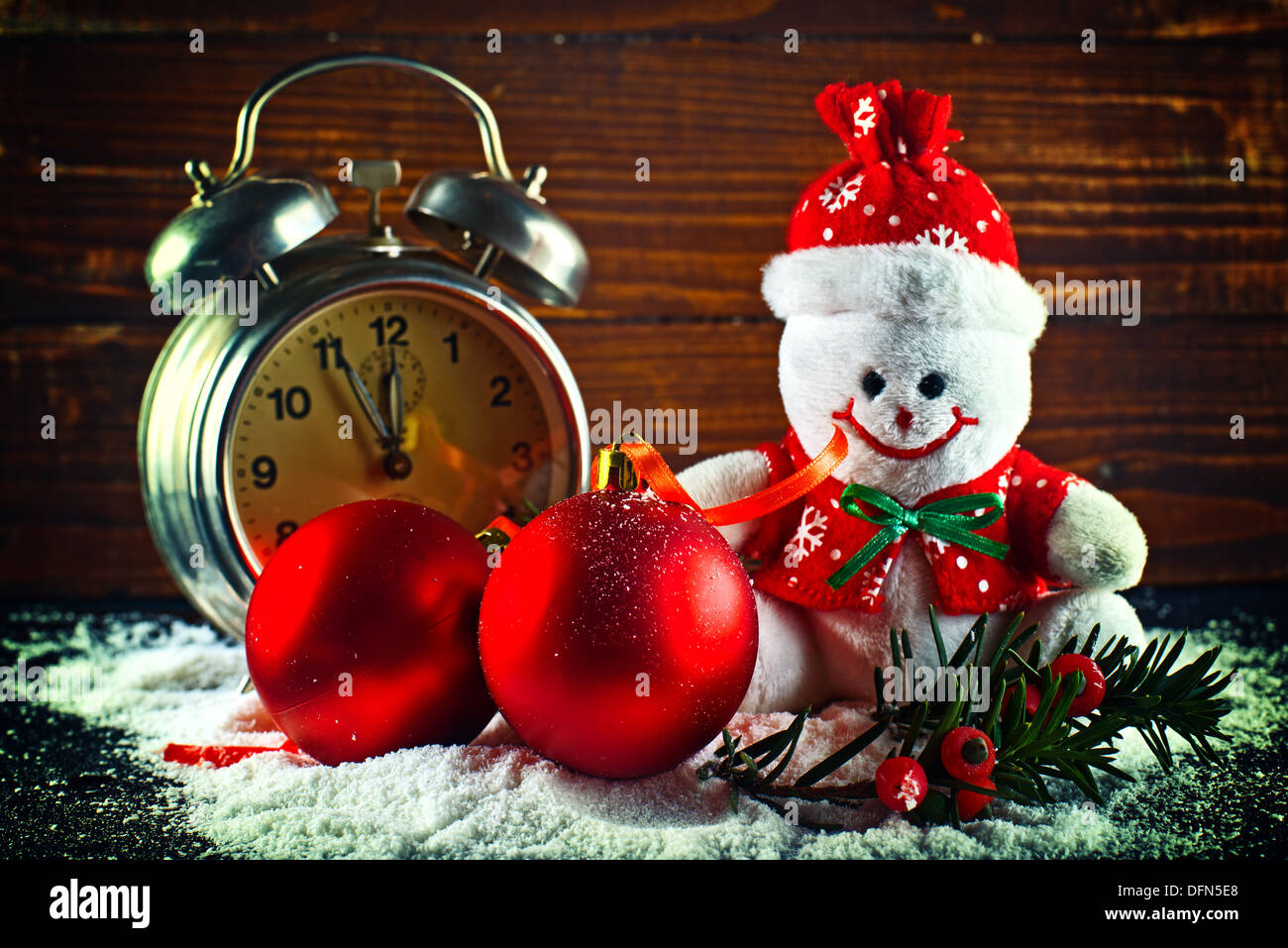Christmas balls and wool snowman as New Years Eve decor. Stock Photo