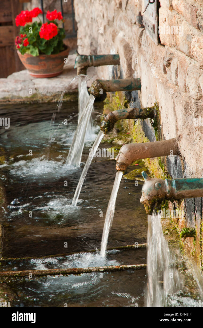 Public fountain from beginnings of the XXth century in a small village of the Cerdanya village in Pyrenees, Spain. Stock Photo