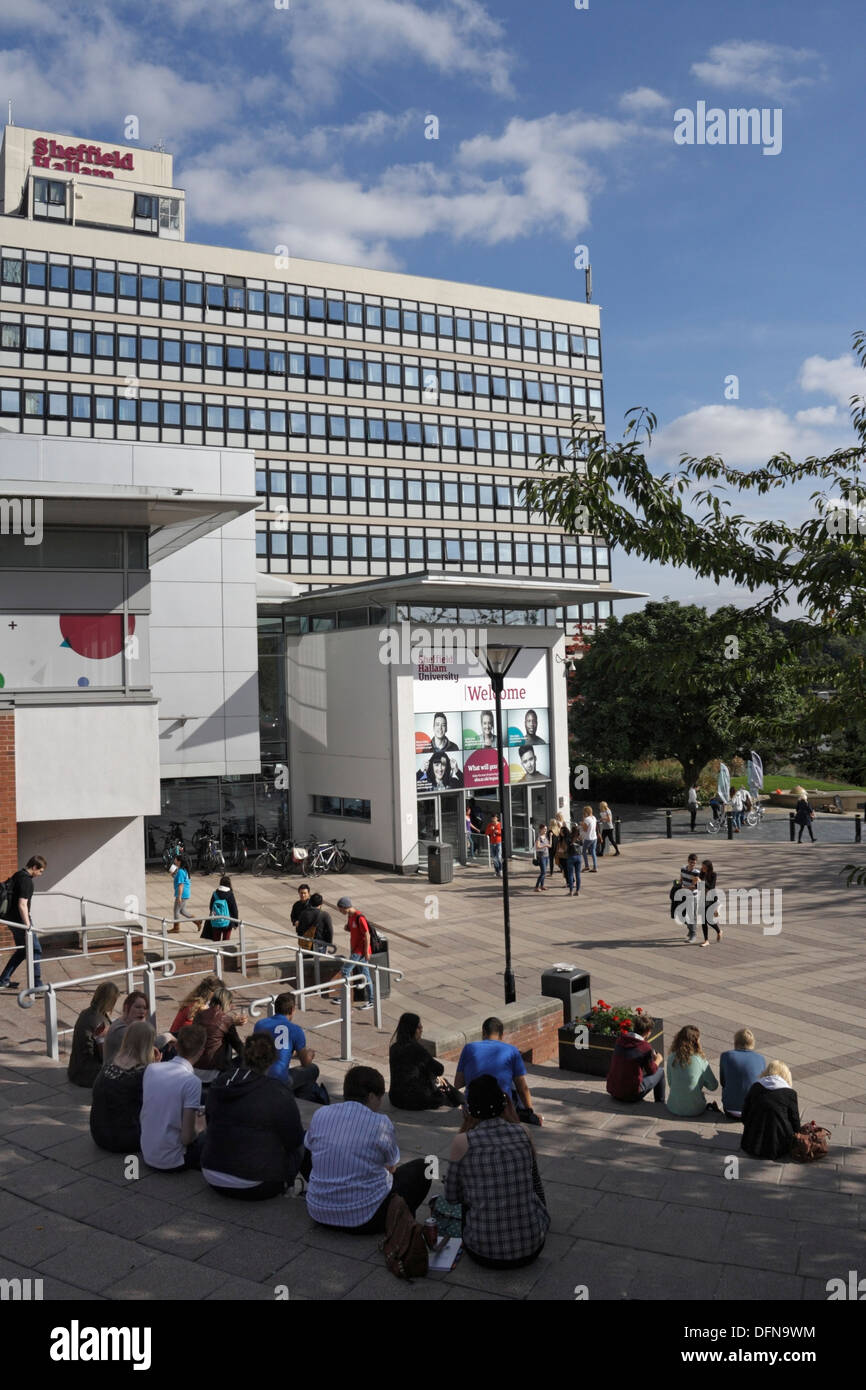 People Students standing out side the entrance of Sheffield Hallam university, Sheffield city centre England Stock Photo
