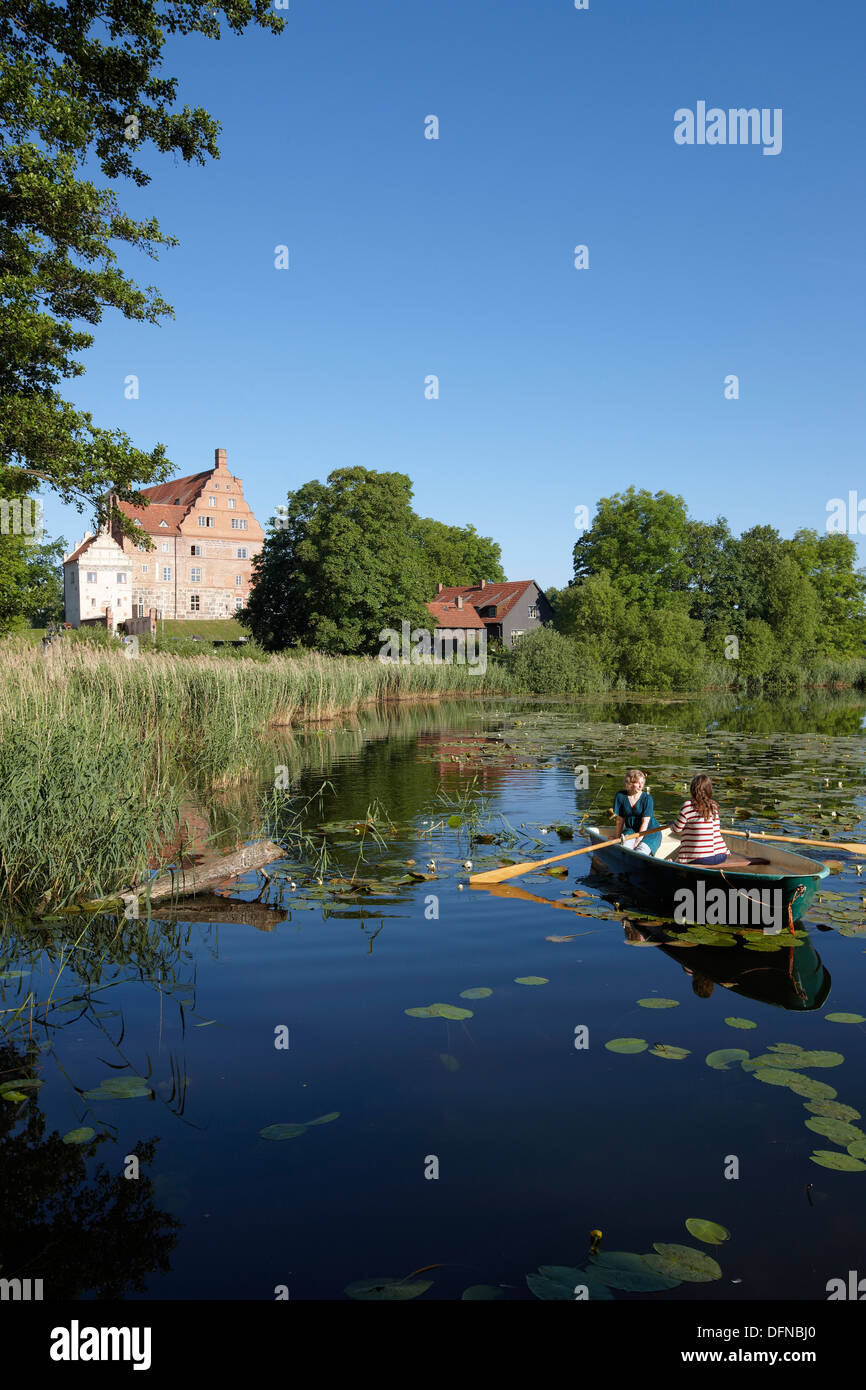 Two women in a rowing boat on lake Ulrichshusen, Ulrichshusen castle, Mecklenburg-West Pomerania, Germany Stock Photo