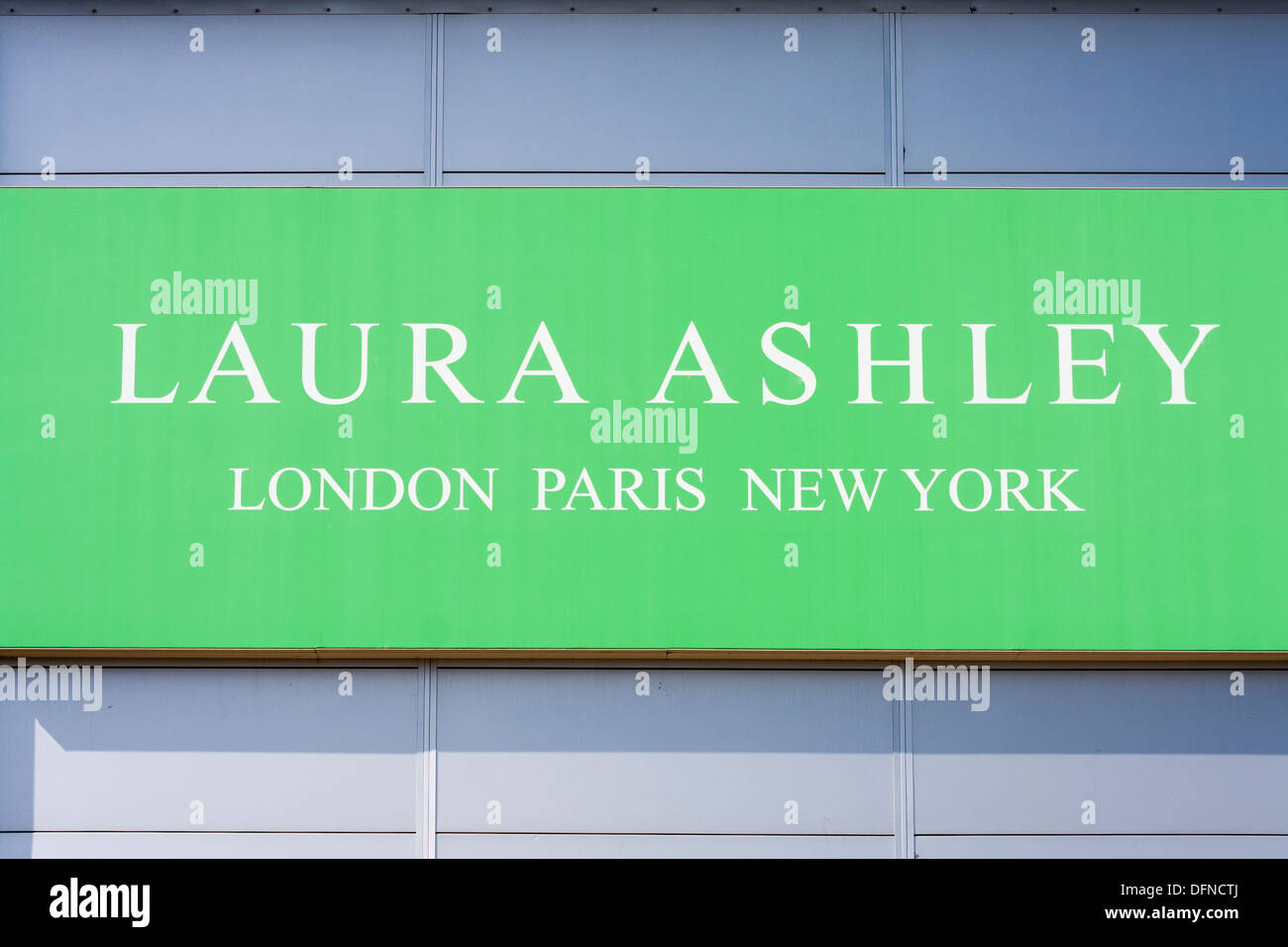 Sign for Laura Ashley retail outlet on side of warehouse Stock Photo