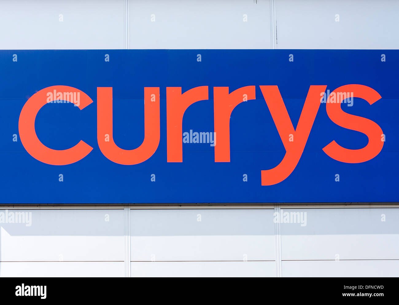 Sign for Currys retail outlet on side of warehouse Stock Photo Alamy