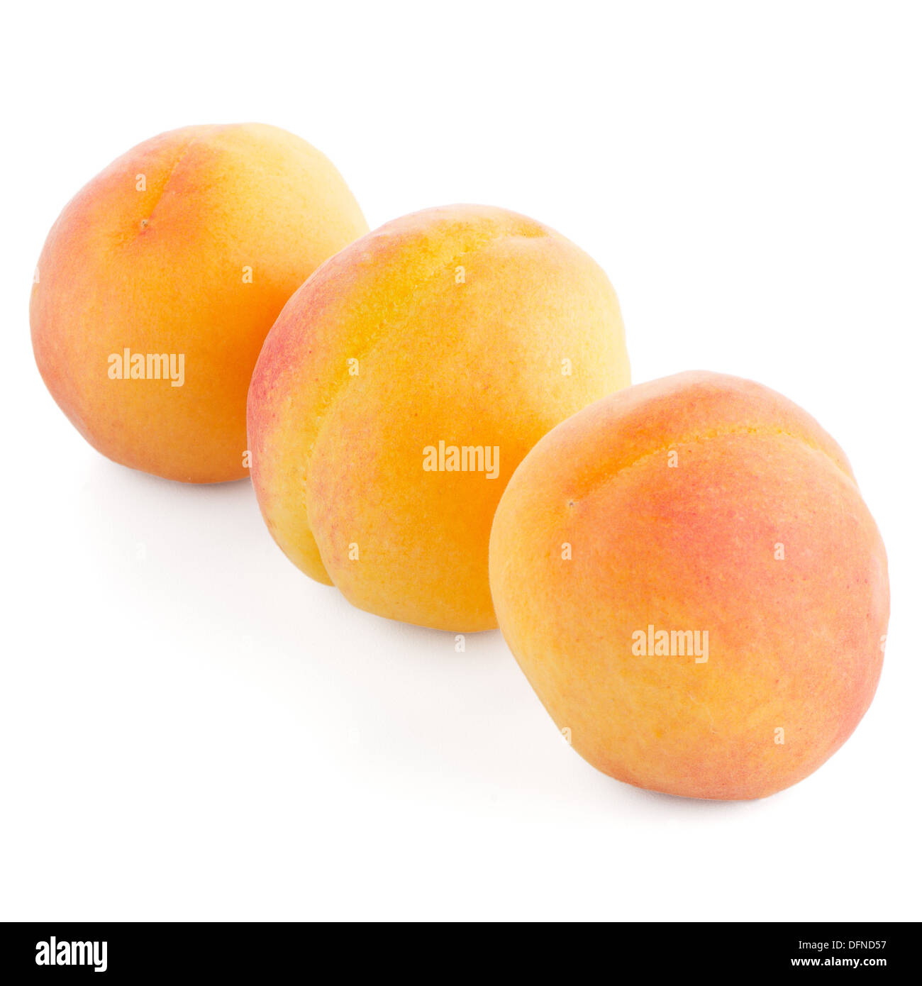 Three sweet peaches on a white background Stock Photo Alamy
