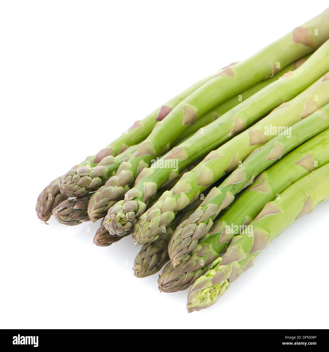 Bunch of green asparagus , in a vertical position, isolated on white