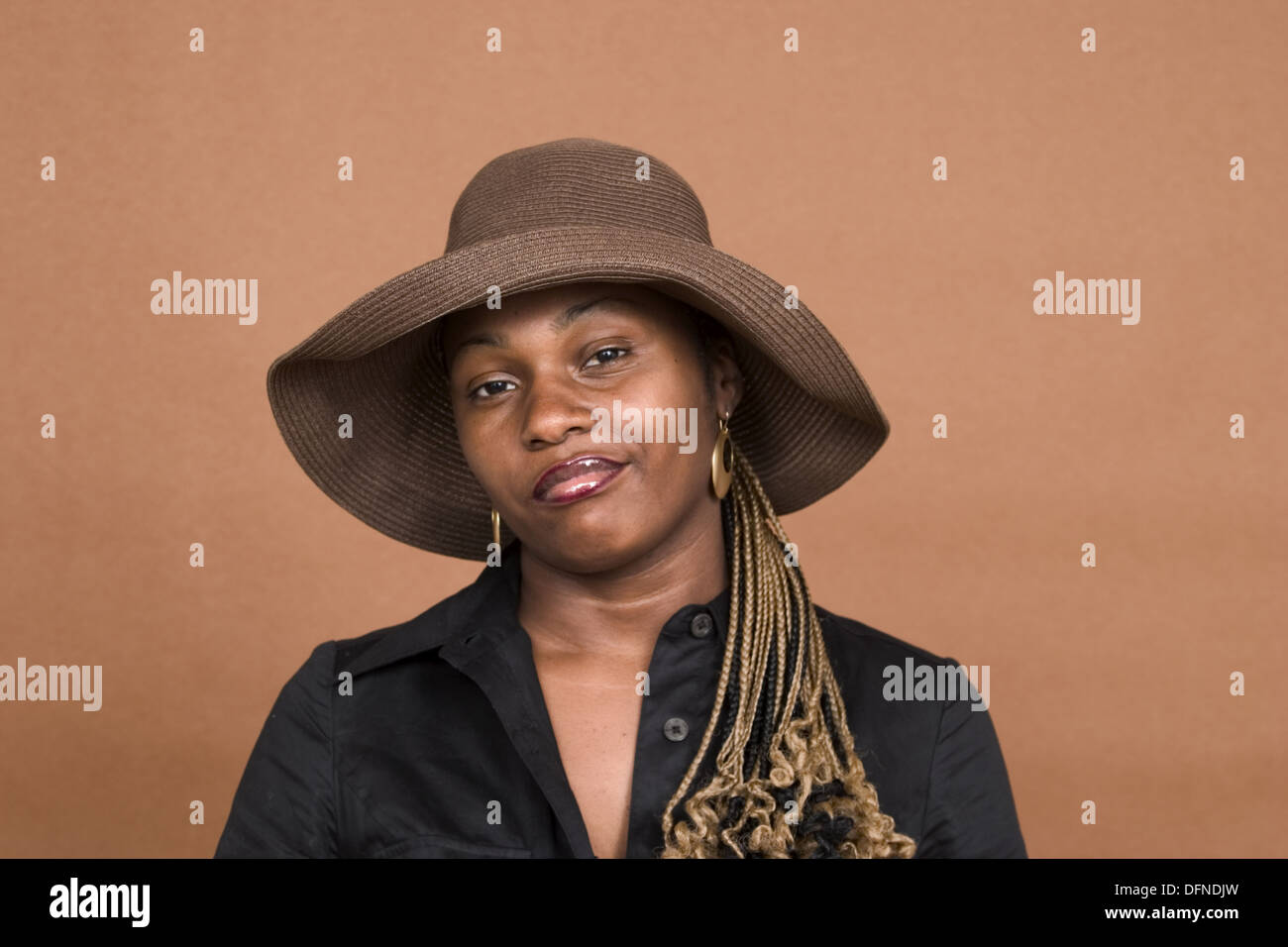 Woman wearing black hat hi-res stock photography and images - Alamy