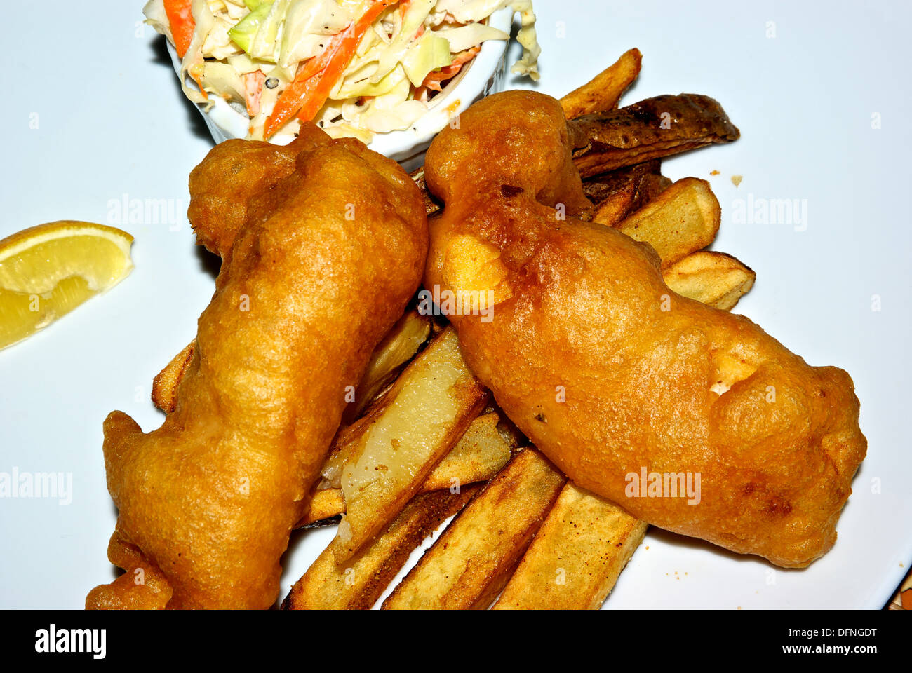 Deep fried battered halibut french fries coleslaw entree main course