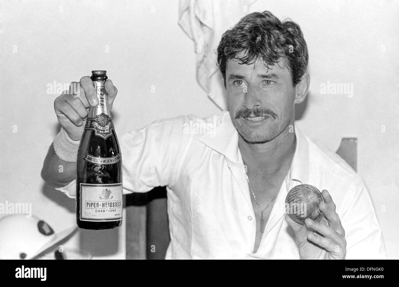 New Zealand bowler Richard Hadlee holds the record ball as he celebrates breaking the record for the most Test wickets during the first test between India and New Zealand November 12, 1988 in Bangalore, India. Stock Photo