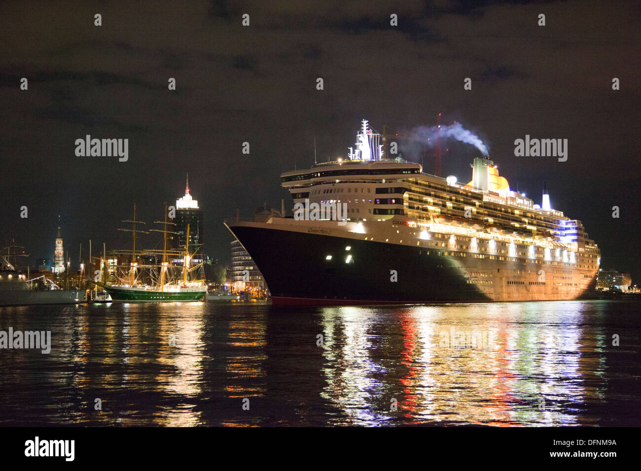 Cruise ship Queen Mary 2 clearing port at night, Hamburg Cruise Center Hafen City, Hamburg