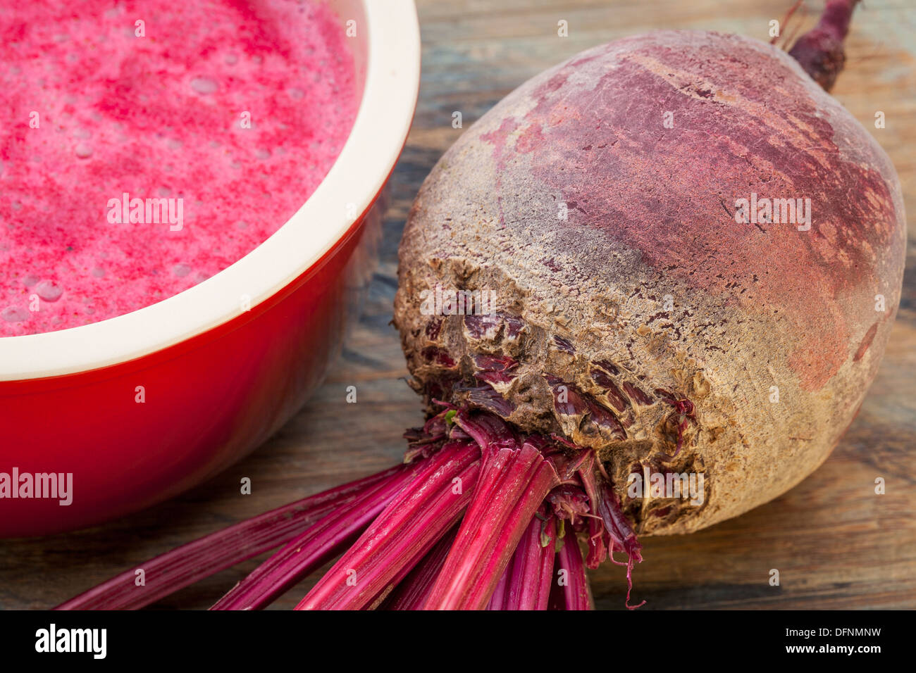 red beet root and cream soup in stoneware bowl Stock Photo