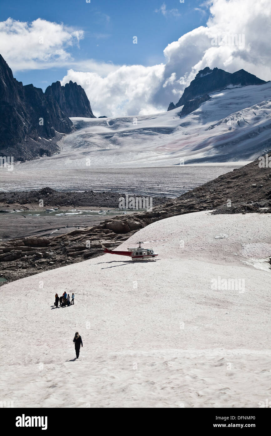 Hiking group waiting to be flown out of the glacier region of the Bugaboos, British Columbia Stock Photo