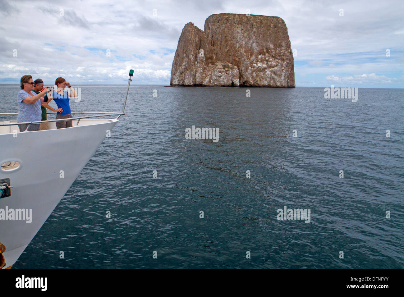 Tourist boat and Kicker Rock in the Galapagos Islands Stock Photo