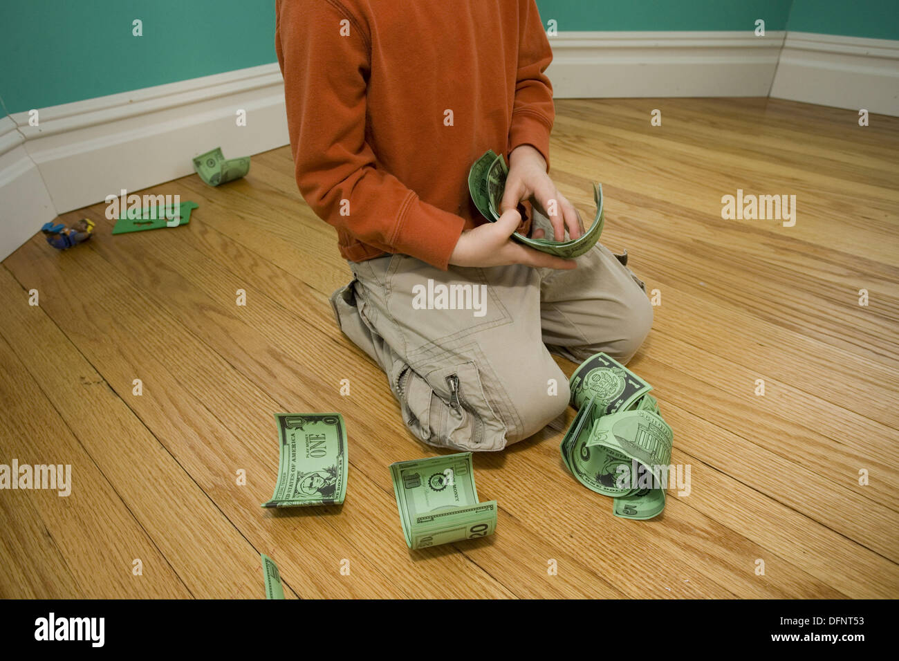 Boy counting paper money. Stock Photo