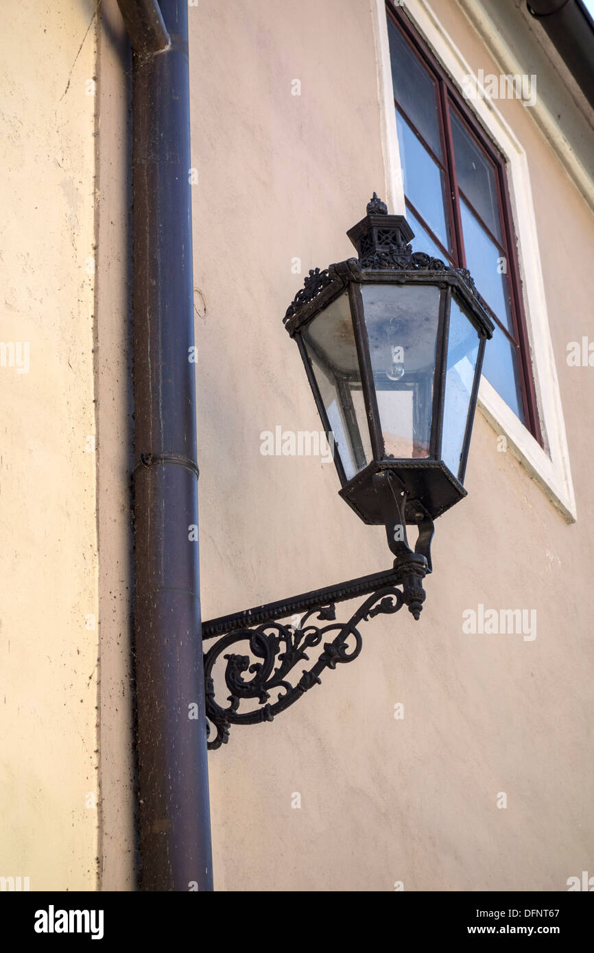 Old street light closeup on the wall Stock Photo