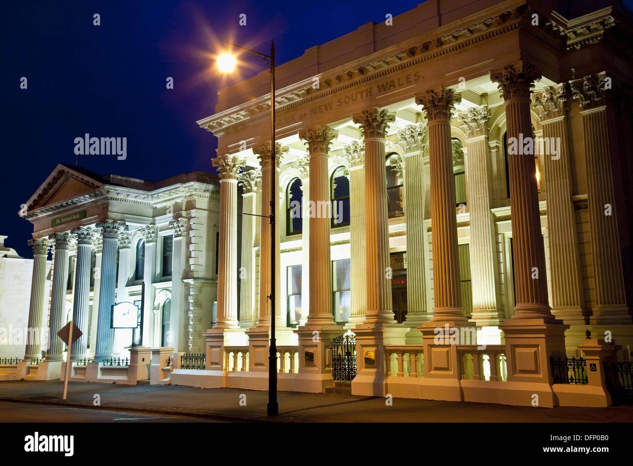 Historic limestone bank building lit up at night, Oamaru, South island
