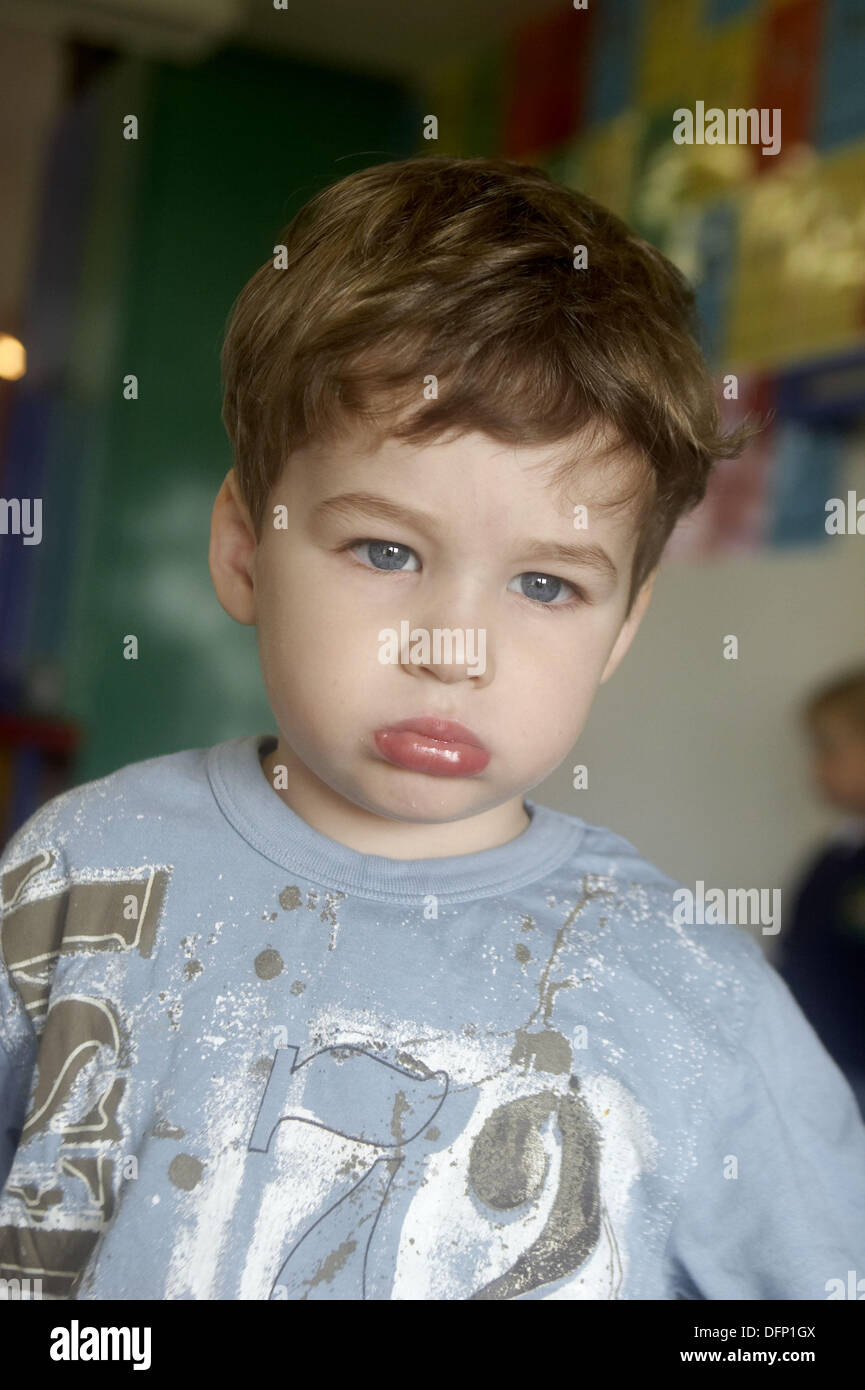 3 Year Old Boy Looking Off Camera At Nursery Stock Photo 61335146