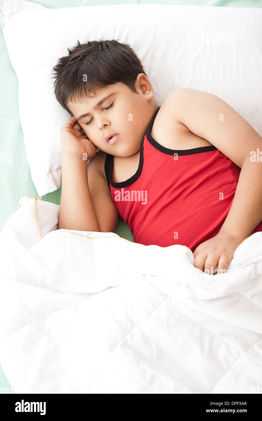 Boy sleeping on the bed Stock Photo Alamy