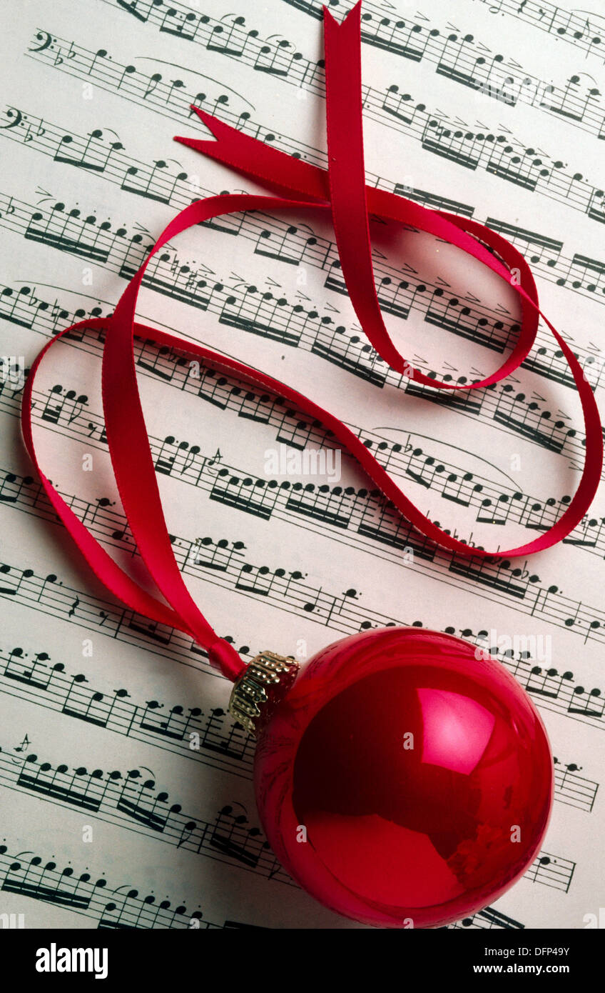Christmas ornament on sheet music Stock Photo Alamy