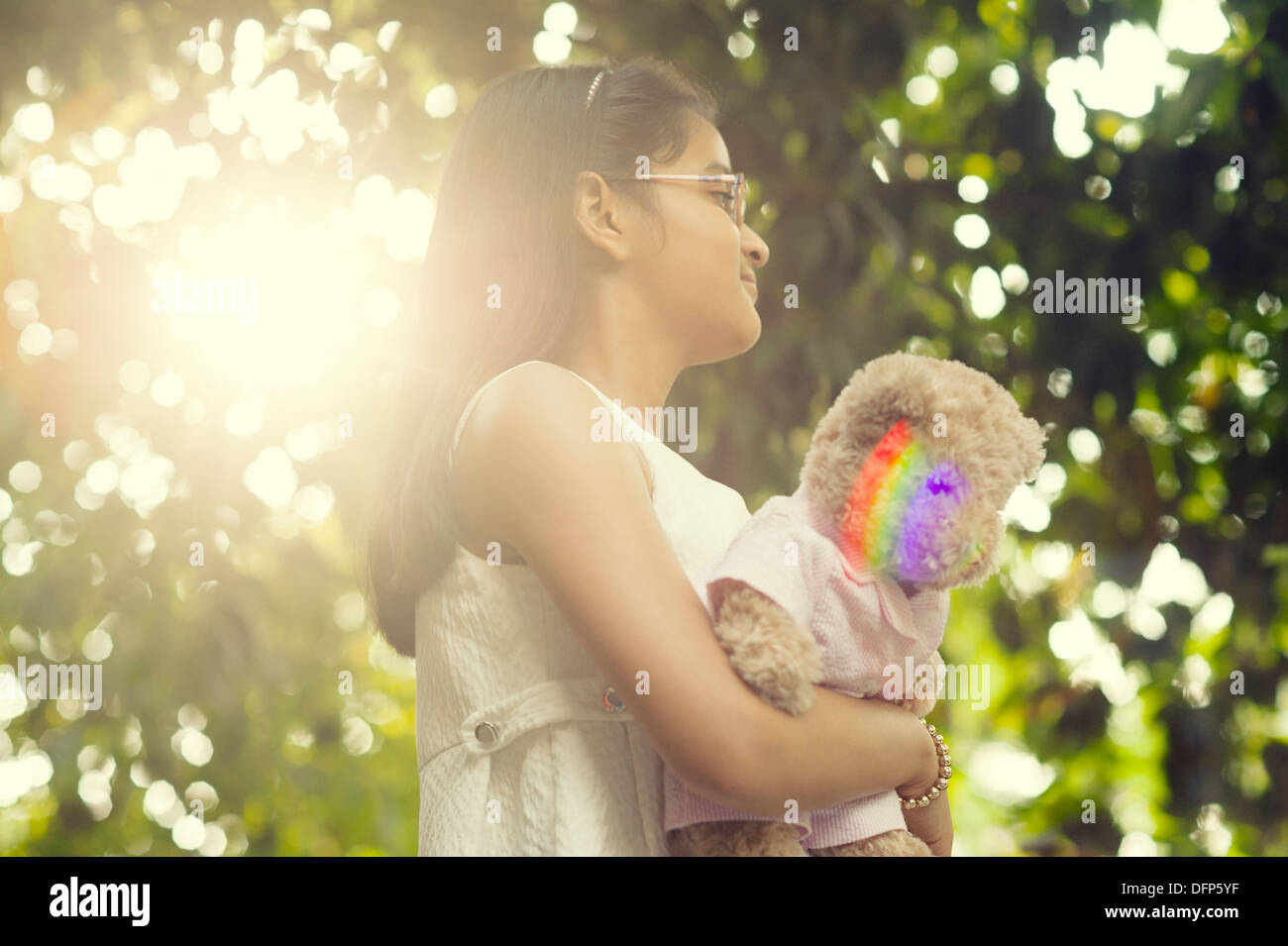 Girl holding a teddy bear Stock Photo - Alamy