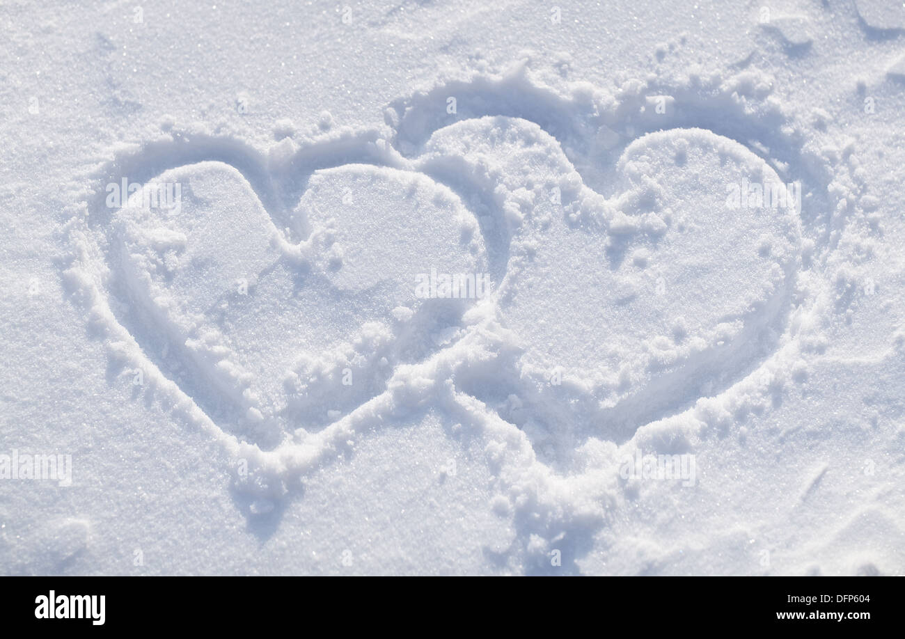 The shapes of heart on the snow. Closeup shot. Stock Photo