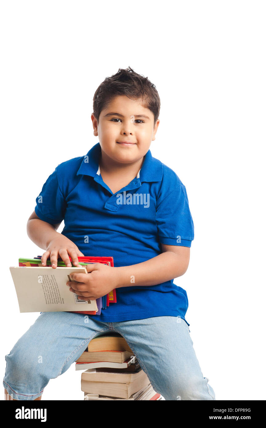 Boy holding books Stock Photo - Alamy