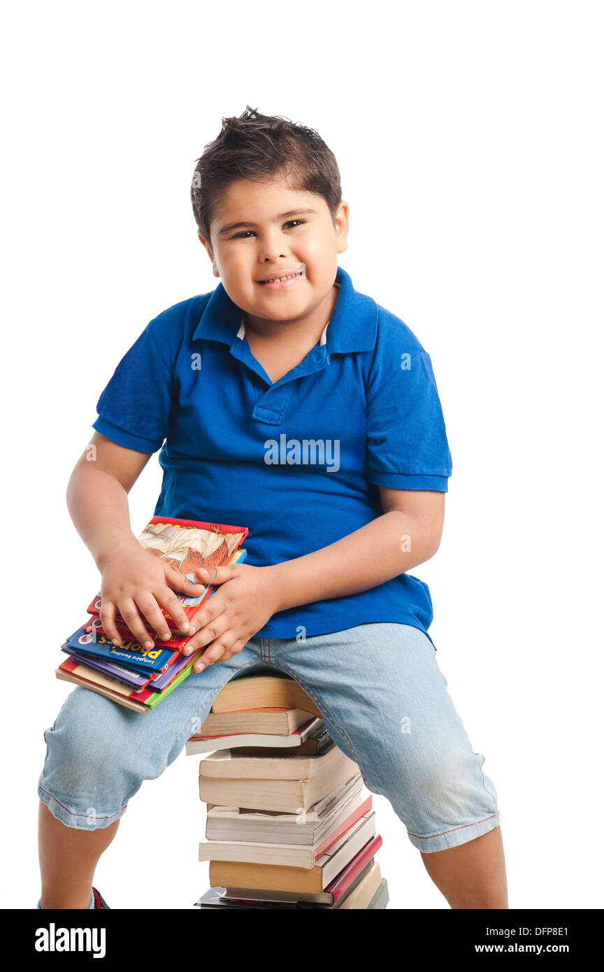 Boy holding books Stock Photo - Alamy