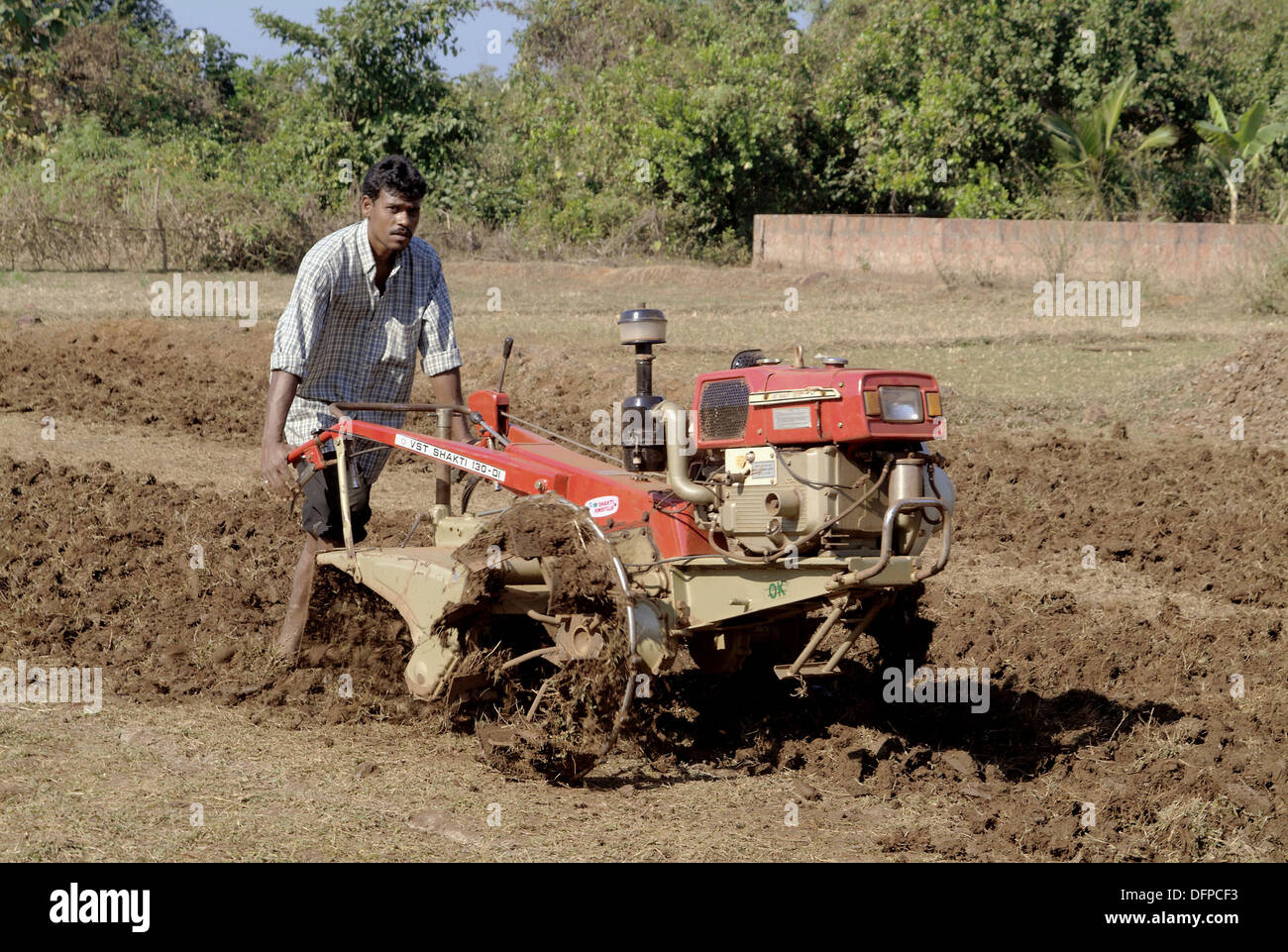Man using the power tiller to plough the fields. Maharasthra. India Stock  Photo - Alamy