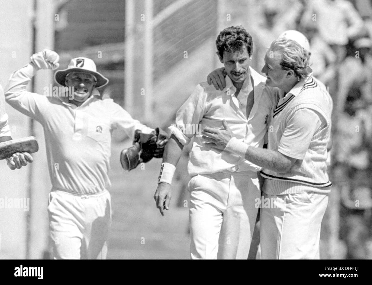 New Zealand bowler Richard Hadlee is congratulated by teammates after Hadlee broke the record for the most Test wickets during the first test between India and New Zealand November 12, 1988 in Bangalore, India. Stock Photo