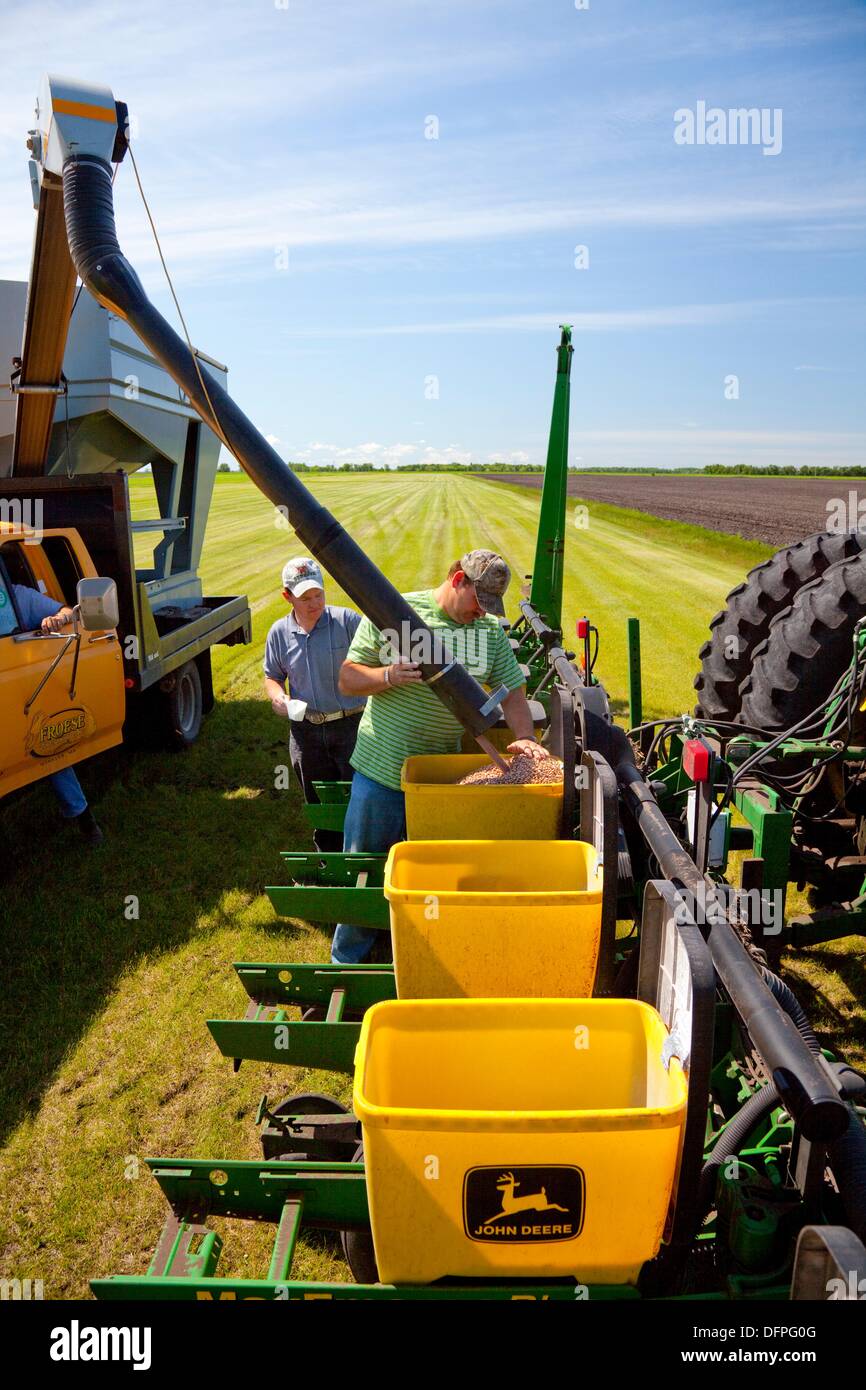 Loading a bean planter at the Froese farm near Winkler, Manitoba, Canada. Stock Photo