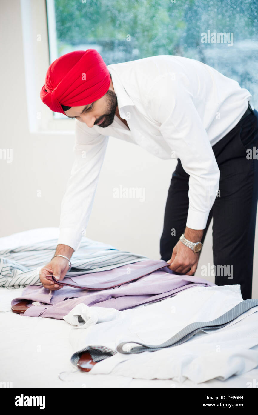 Sikh man matching tie with his suits Stock Photo