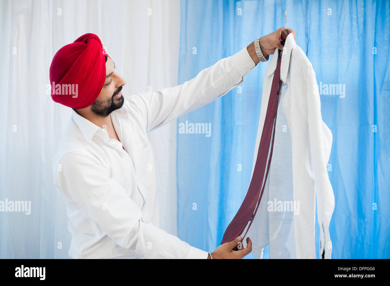 Sikh man matching a tie Stock Photo