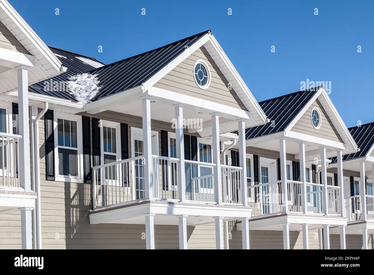 New townhouses under a layer of freshly fallen snow. Stock Photo