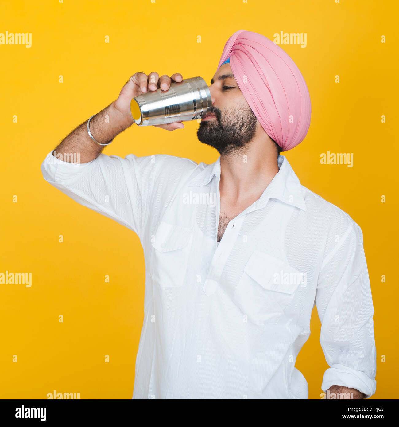 Close-up of a Sikh man drinking lassi Stock Photo