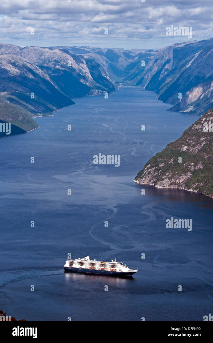 View from Prekestolen in southern Norway up into Lysefjorden with Holland America Line Rotterdam turning to return to open water Stock Photo
