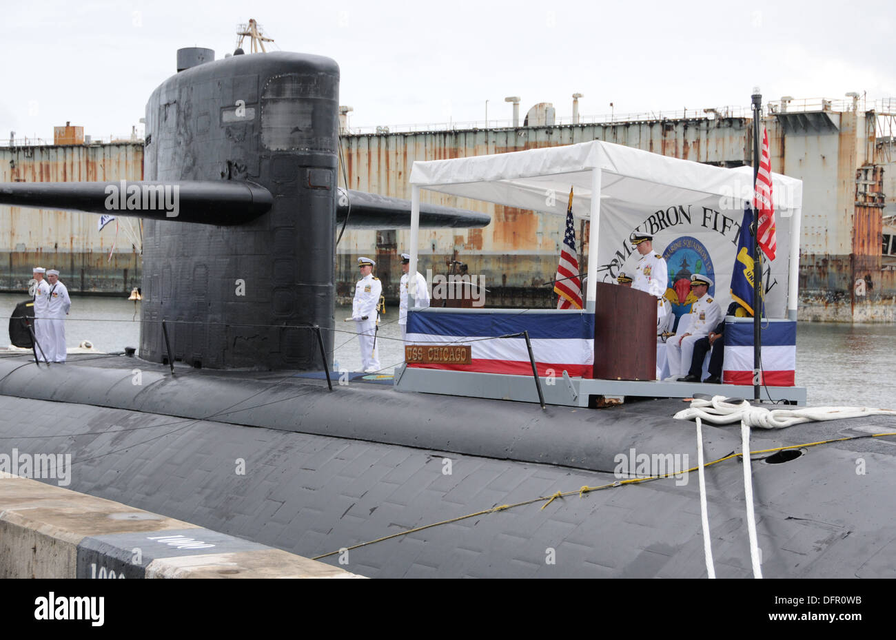 APRA HARBOR, Guam (Sept. 27, 2013) Cmdr. Nicholas Tilbrook gives his farewell speech during the change of command ceremony aboard the Los Angeles-class attack submarine USS Chicago (SSN 721). Cmdr. Lance Thompson relieved Tilbrook as commanding officer of Stock Photo