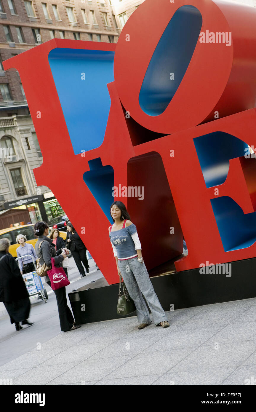 Woman posing in front of giant ´Love´ sculpture. New York City. New