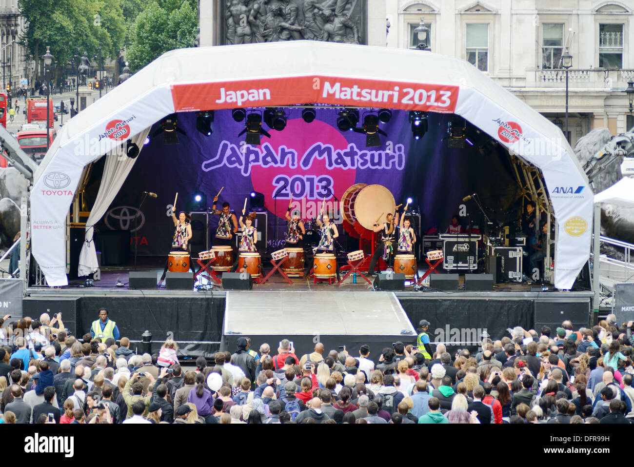 Taiko drummers at Japan matsuri in London UK. Showing crowd of people and red buses. Saturday 5th October 2013 Stock Photo