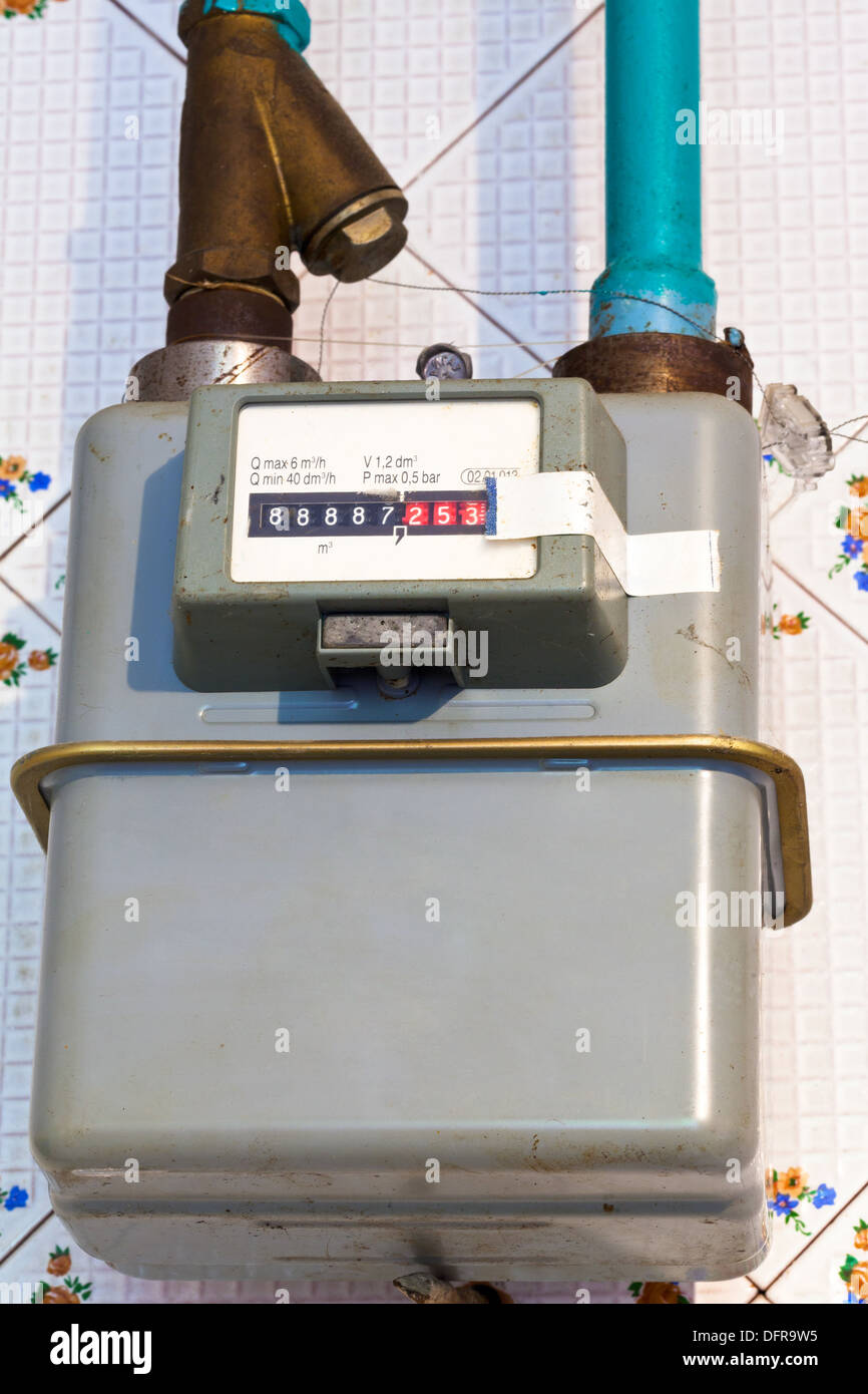 residential gas meter of usual diaphragm style on home flat Stock Photo