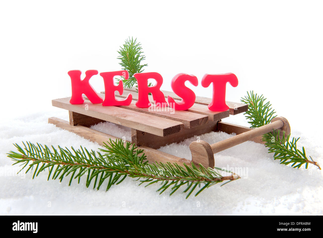 The dutch word for christmas "kerst", red letters on a sleigh, with a pine  branch Stock Photo - Alamy