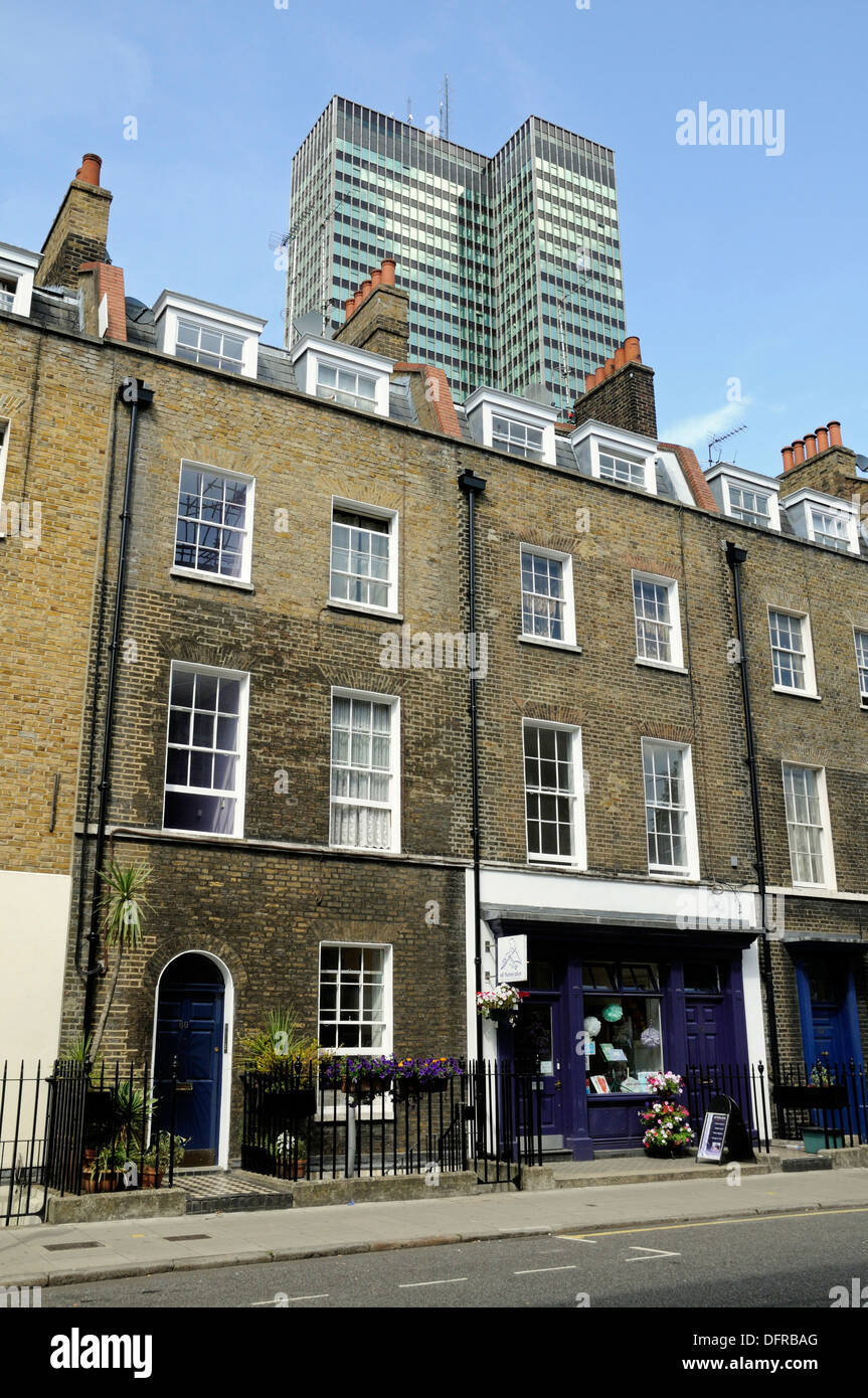 Gerogian houses with shop front set into one of them, with Euston Tower behind, Warren Street, Central London, W1, England, UK Stock Photo
