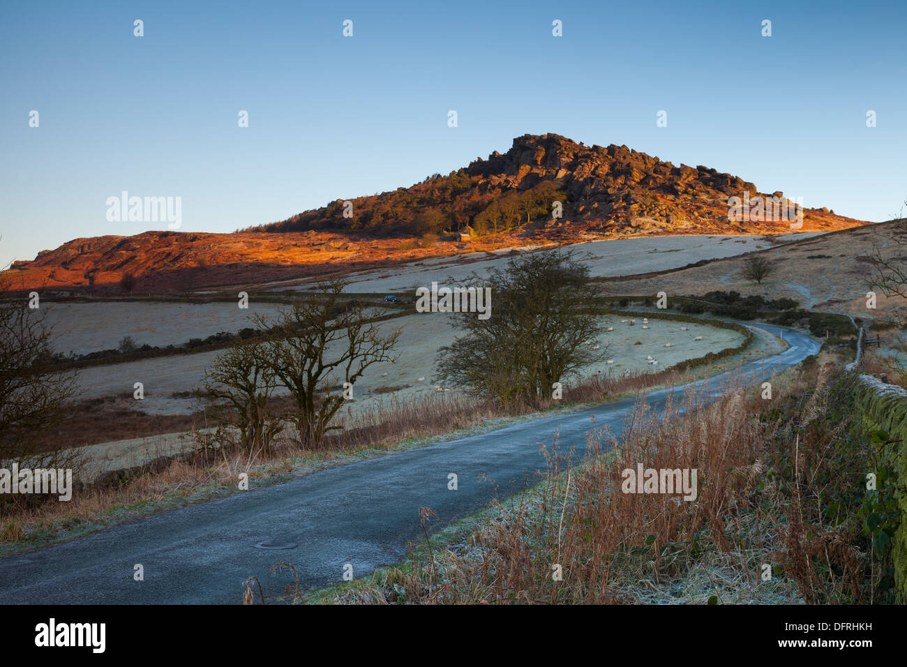 Early sun glowing on the Roaches in the English Peak District Stock Photo