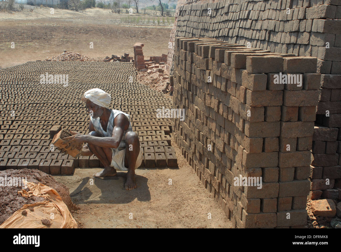 Bareli tribal man brick worker making bricks. Stock Photo