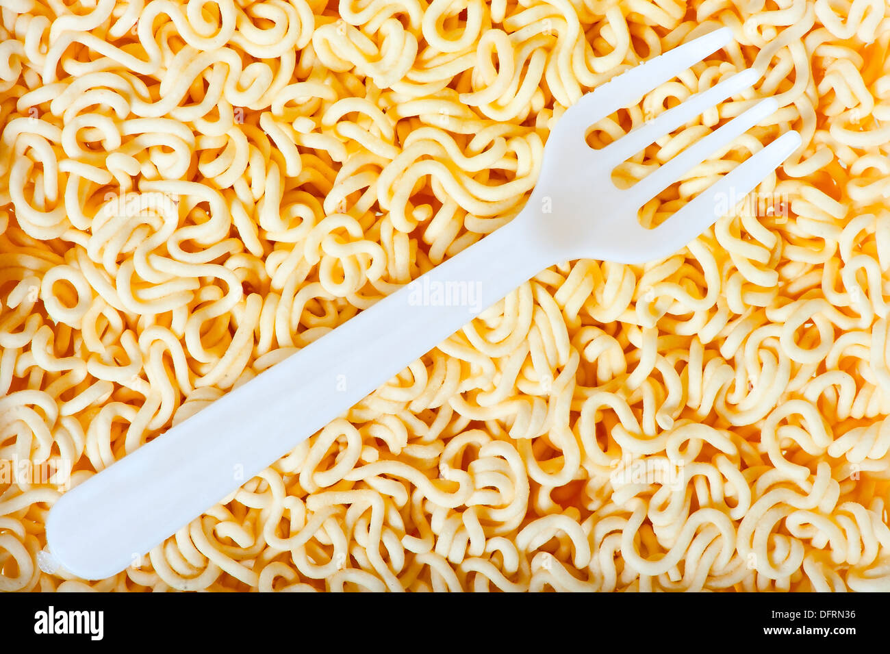 disposable fork on instant noodles close up Stock Photo