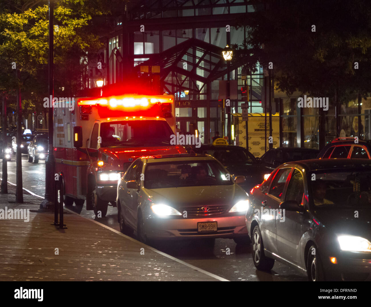ambulance blocked by traffic in busy street, Philadelphia city center, Pennsylvania, USA Stock Photo